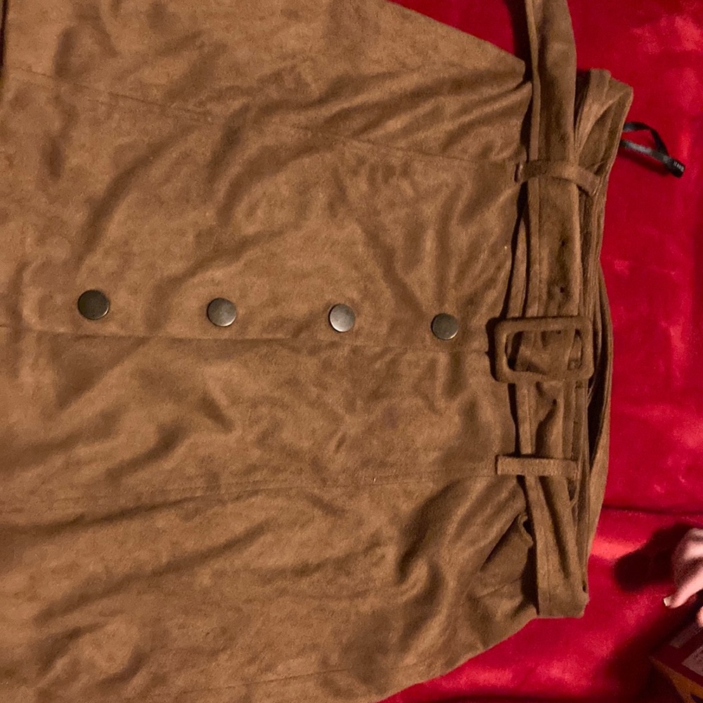 A brown soft skirt with buttons, and a belt that matches